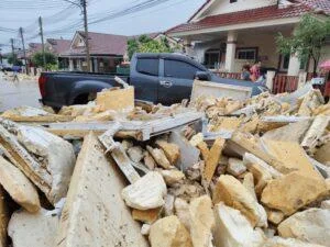 Foam Waste from Illegal Dump Floods Thai Village in Sri Racha After Wall Collapses in Heavy Rain